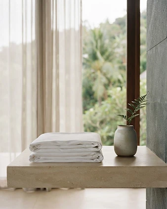 Immaculate linen and stone details in a Samui villa