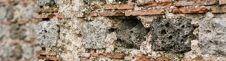Weathered Roman-era coursed masonry and tile with lime mortar
