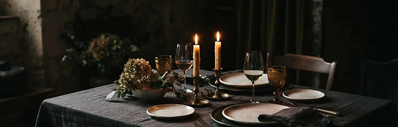 Private dining table set with linen and candlelight
