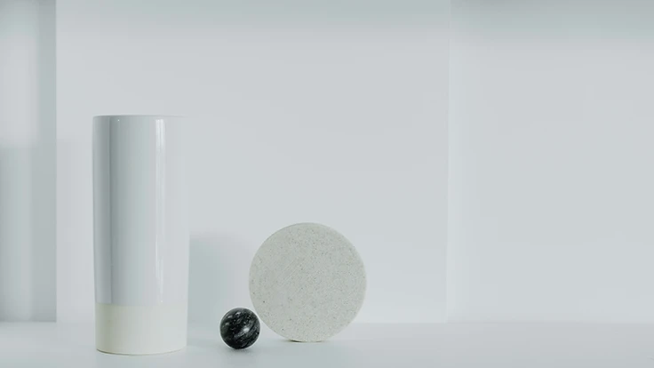 Abstract minimalist still life with vase, sphere and disc on a white shelf