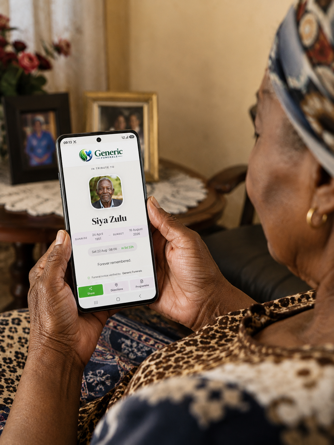 A family member viewing an In Tribute funeral page on a phone