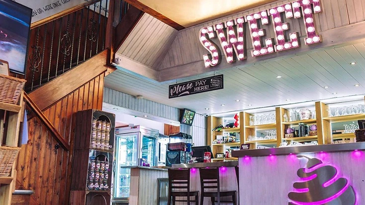 Inside the best diner in Manchester with the SWEET marquee sign