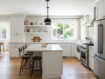 Modern kitchen remodel with white cabinetry and quartz countertops