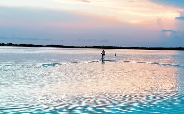 Water bike on calm waters at sunrise