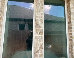 Large double windows on brick home