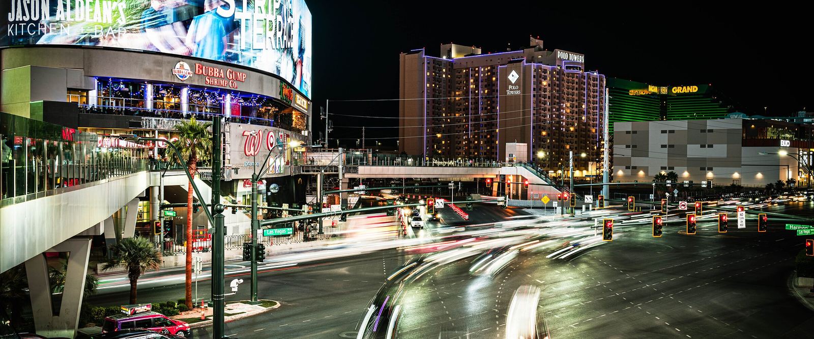 A Las Vegas street at night with the MGM Grand hotel in the background