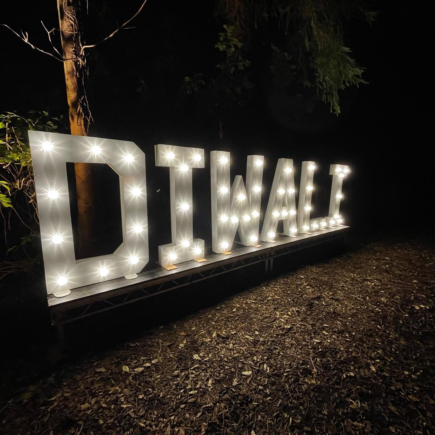 DIWALI marquee letters lit up outdoors at night
