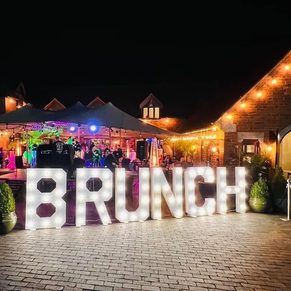 BRUNCH light-up letters at an outdoor night event