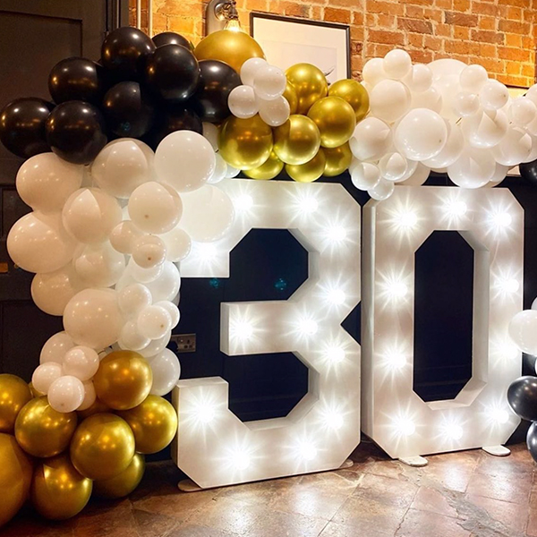 Illuminated 30 marquee number with balloon arch
