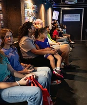 Kids and families gaming inside the REI gaming truck