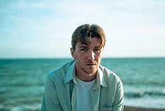 Close-up portrait of Max White by the sea