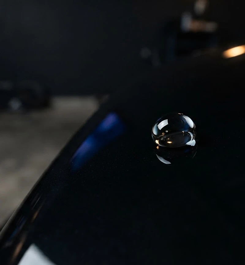 Water droplet beading on ceramic-coated black paint