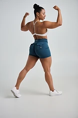 From the back. Glute max builds the shelf. Glute medius and minimus build the width across the outside of the hip.