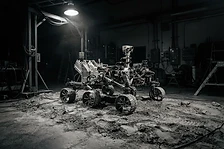 Rover chassis prototype in a dark test bay