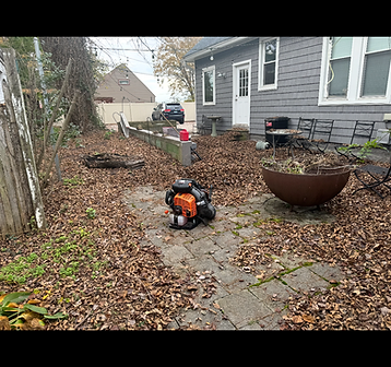 Patio covered in fallen autumn leaves before cleanup