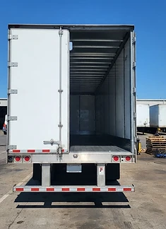 Rear of a dry van trailer opened for inspection