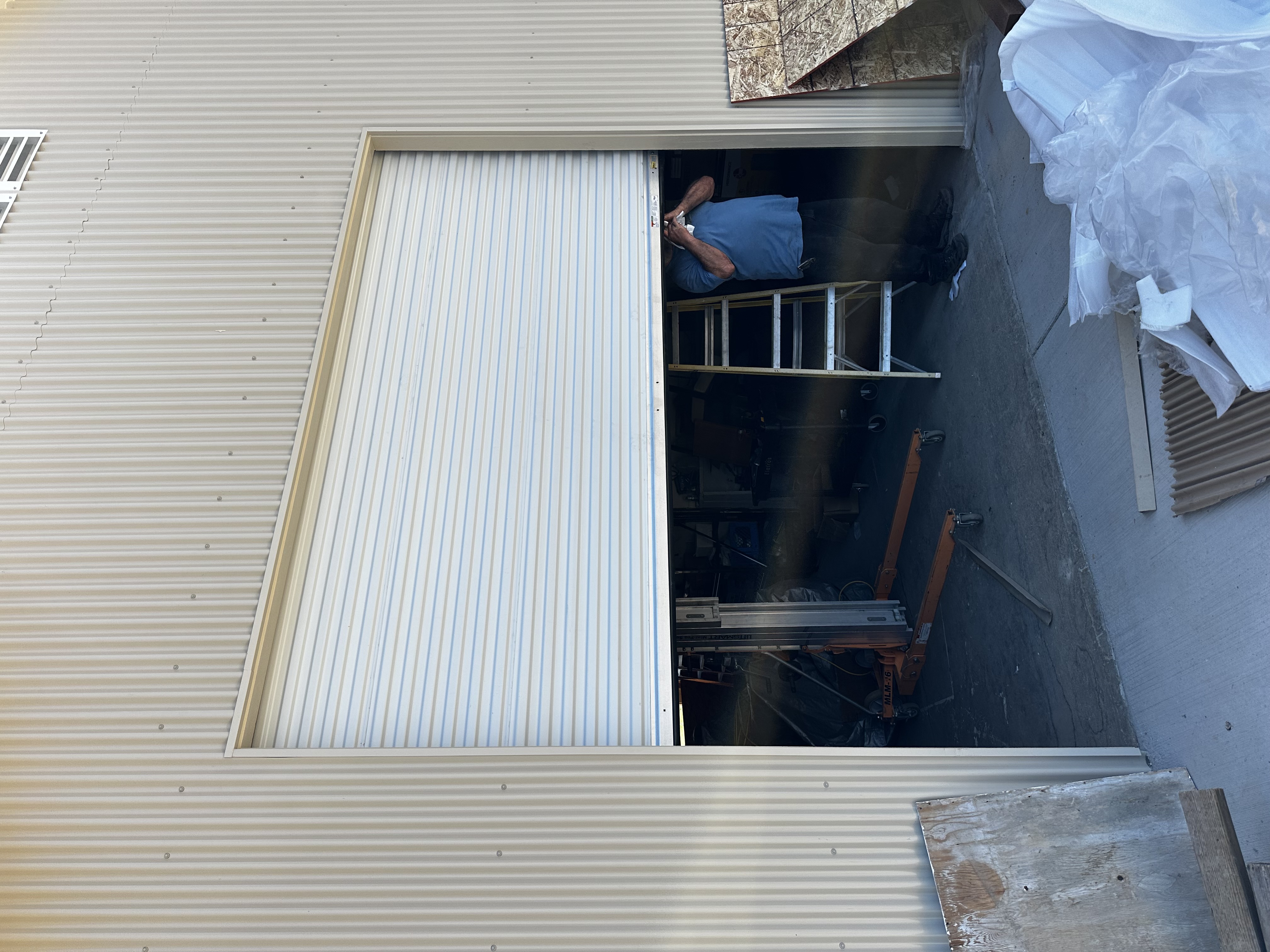 Roll-Up Sheet Door Installation In Progress — Guardian Door LLC project in Sacramento, CA
