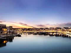 Friday Harbour marina at sunset with waterfront condos and boats