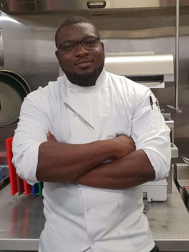 Portrait of Chef Babatunde “Tunde Abi” Abifarin in a professional kitchen