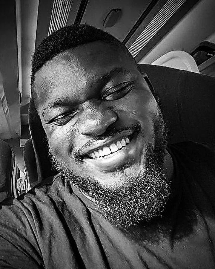 A candid black-and-white portrait of Chef Babatunde Abifarin