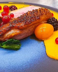 Duck breast with berries and mango purée