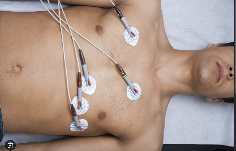 Doctor performing cardiovascular procedure on patient