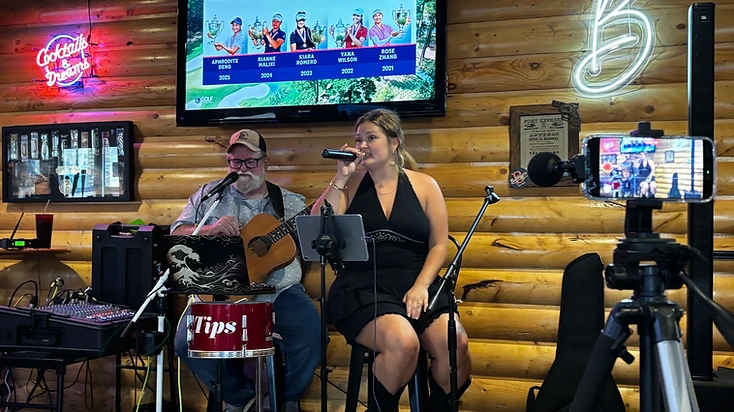The LeeLynn's performing live on stage under warm lights