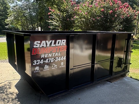 15-yard steel dumpster on a residential driveway