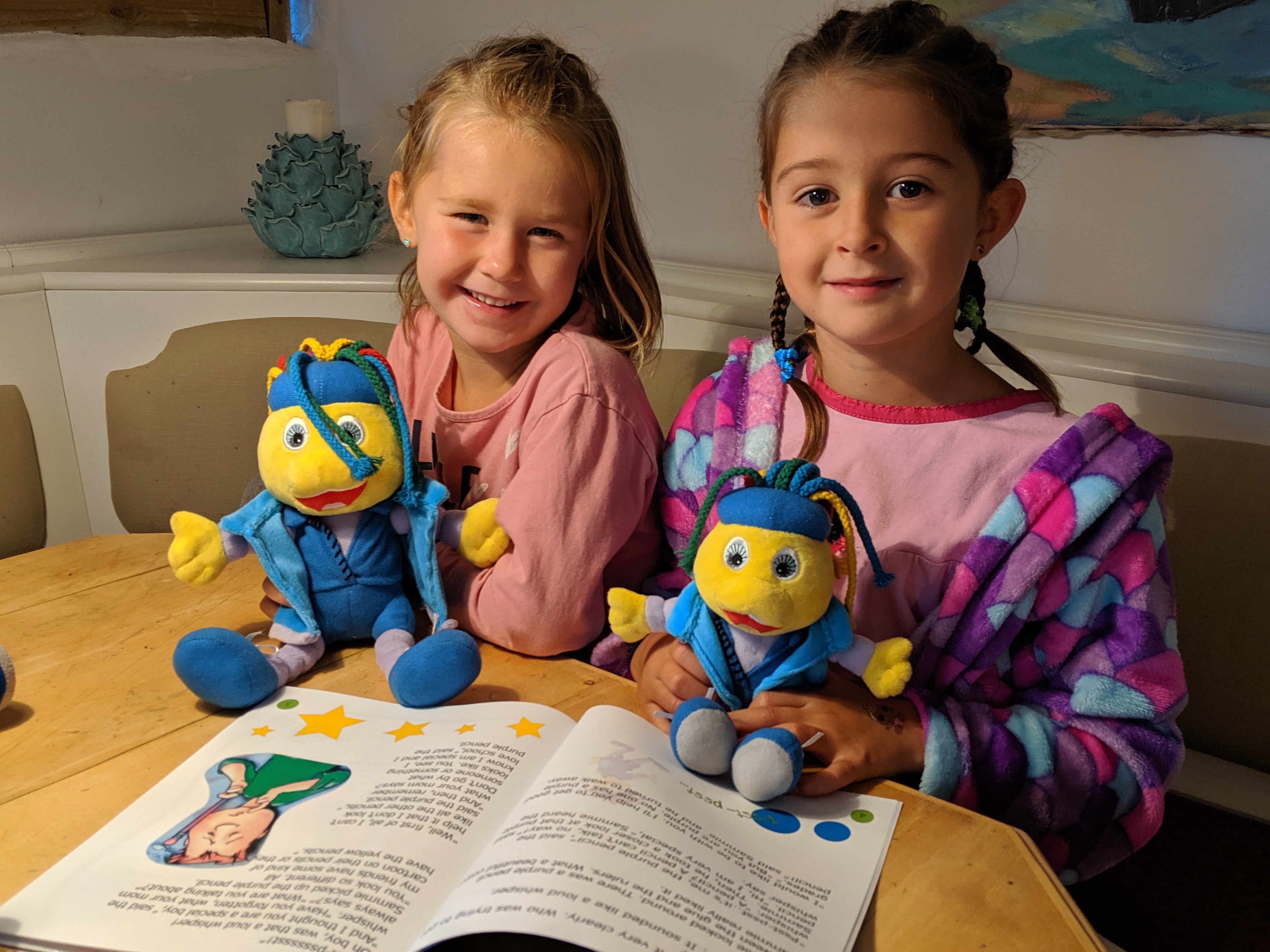 Lily and Jasmin reading together with Toley Ranz.
