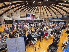 Collectors, families, and vendors filling a PTCC card show