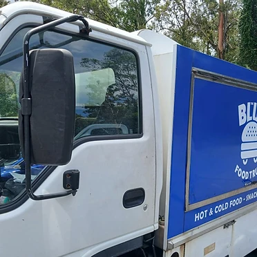 The Blue Food Truck — side view showing open serving window
