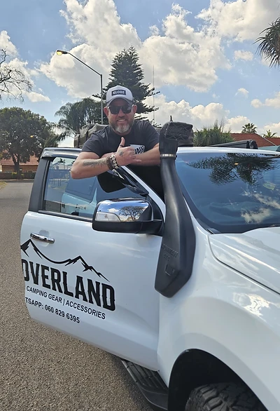 The owner of 12V Overland with his rigged 4x4