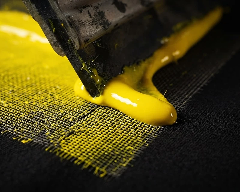 Macro close-up of ink pulled through a silk screen mesh