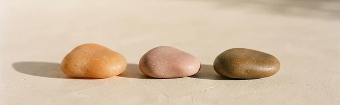 Three balanced stones in warm tones