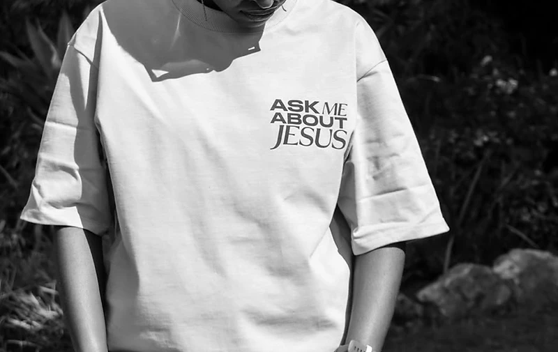 Model wearing the AMAJ chest logo