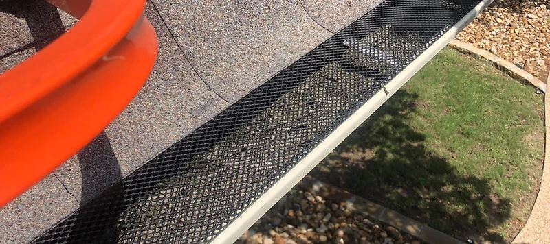 Mesh gutter guard installed over a seamless gutter on an Austin-area home