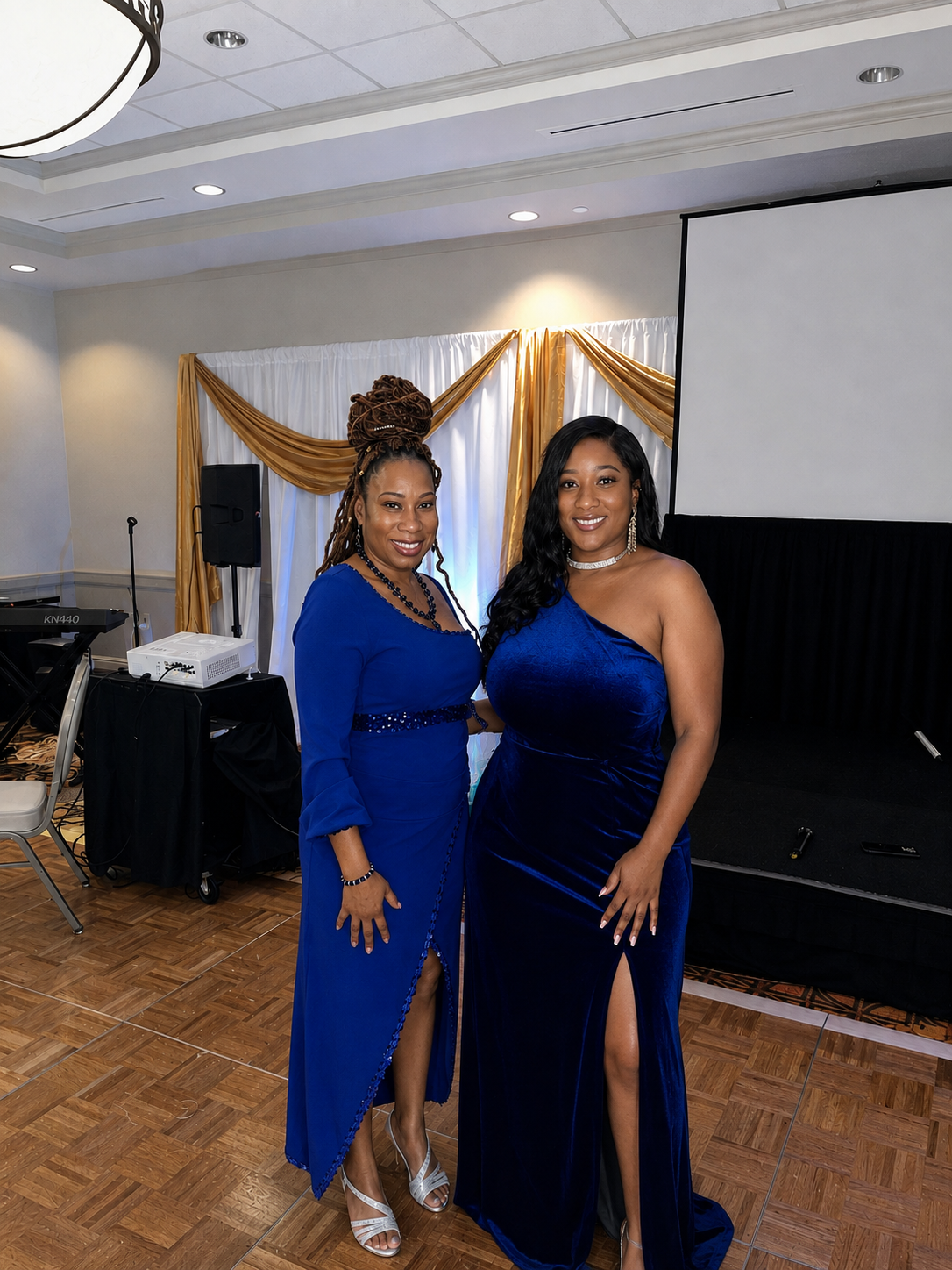 Gala Celebration - two women posing together at a formal gala event