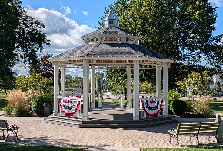 The white gazebo on the Westfield Center Village green, draped in patriotic bunting