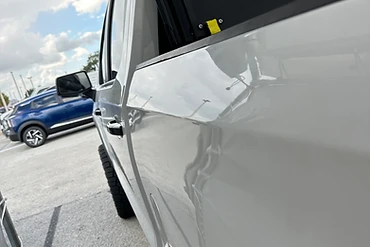 Silver Pickup Driver-Side Panel Ding - after