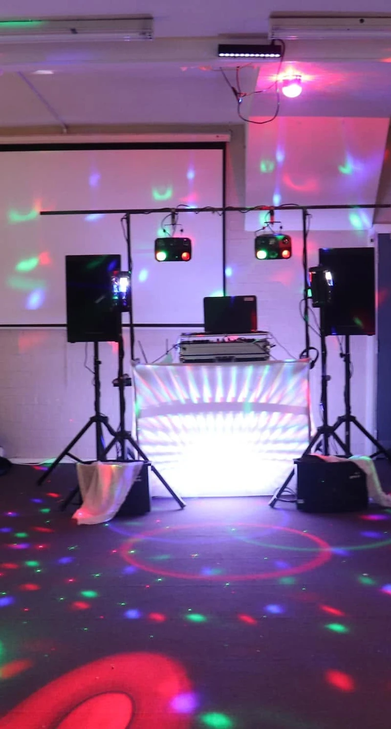 Nash Dom Christmas event with stage lights and DJ
