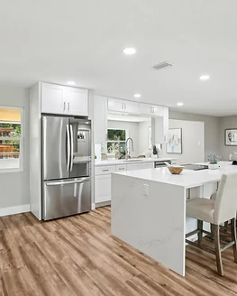 Completed kitchen renovation with waterfall island in Tampa Bay