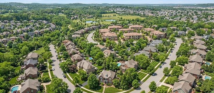 Aerial view of a residential neighborhood — the market Capital 26 finances