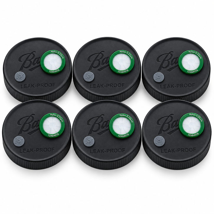 Six wide-mouth liquid culture jar lids with green 0.22 μm syringe filters and grey self-healing injection ports, arranged in a 2x3 grid on a white background