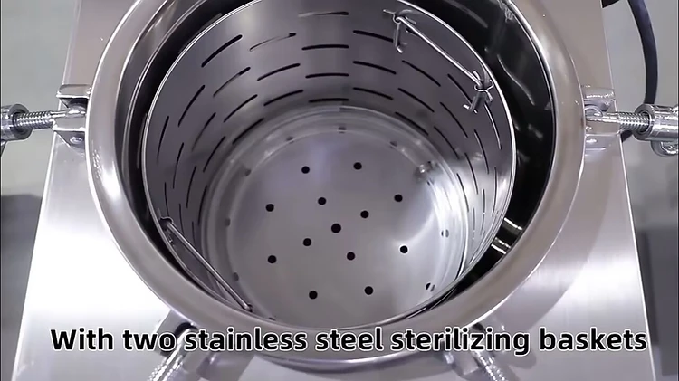 Top-down view into the open 150L autoclave chamber showing two stainless steel sterilizing baskets