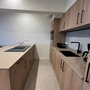 Kitchen with freezer and built-in extractor hood