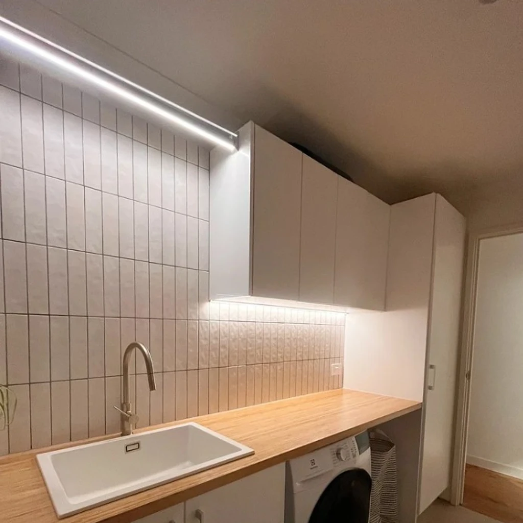 LED strip and under-cabinet lighting in a renovated laundry