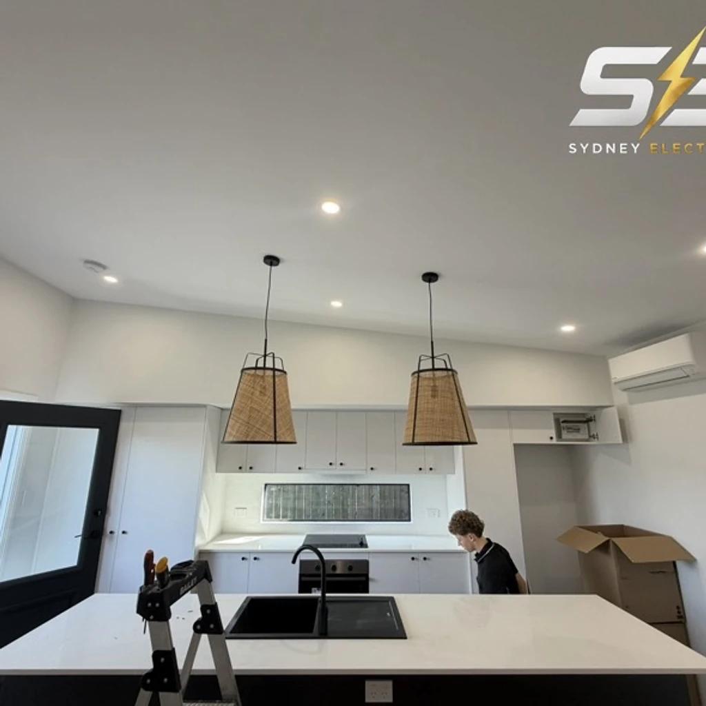 Pendant lighting installed above a new kitchen island
