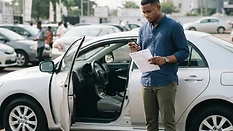 Used car buyer checking vehicle details before payment in Nigeria