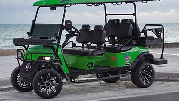 Lime green golf cart by the ocean