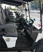 Driver side interior of white golf cart